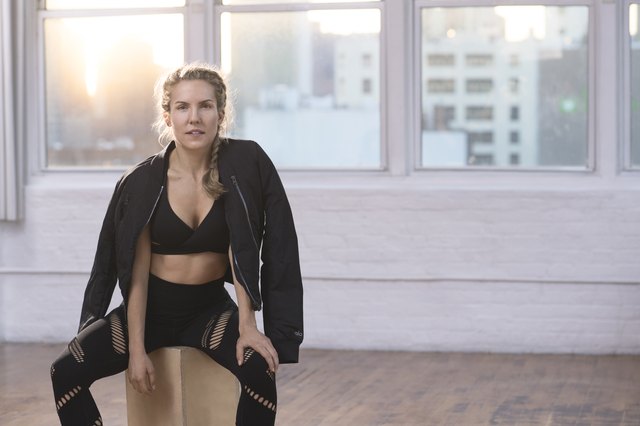 celebrity personal trainer Anna Kaiser against a pink backdrop