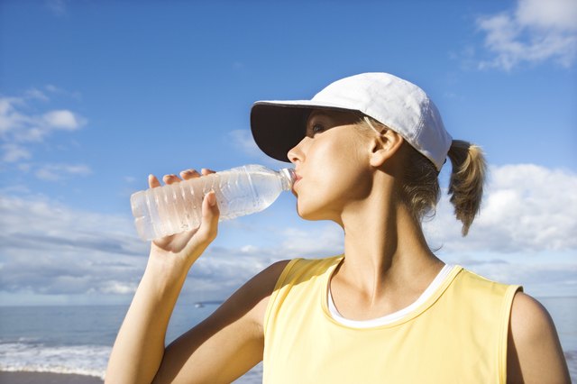 Woman drinking water.