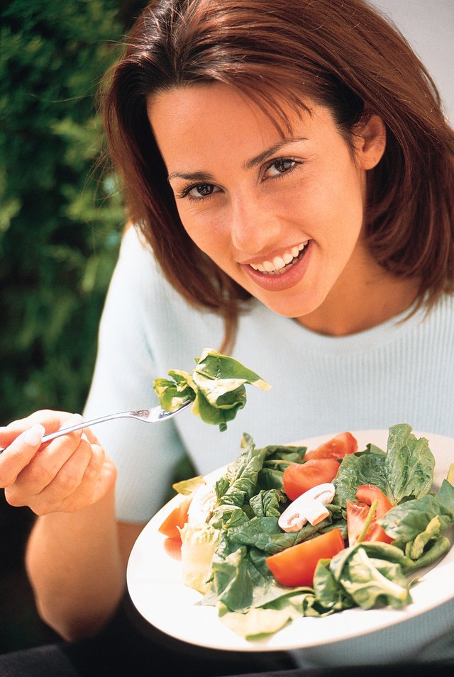 Woman eating salad