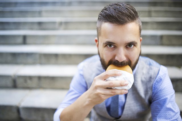 Hipster businessman during lunchtime bream