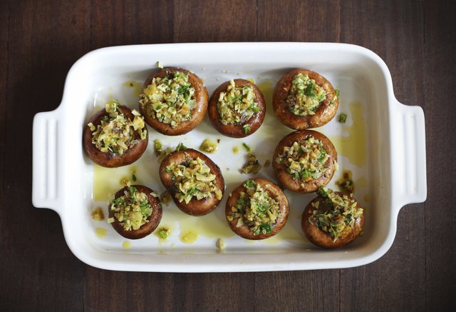 "Button, portobello mushrooms stuffed with cheese and herbs"