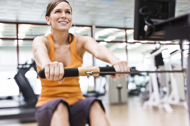 Woman working out on rowing machine.