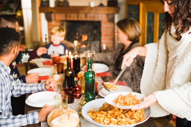 Beautiful family sitting at the table enjoying the christmas meal