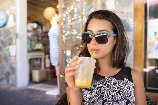 Pretty girl sipping