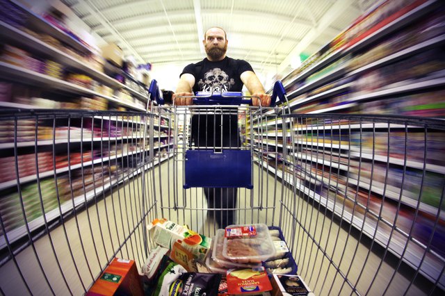 Man pushing shopping trolly