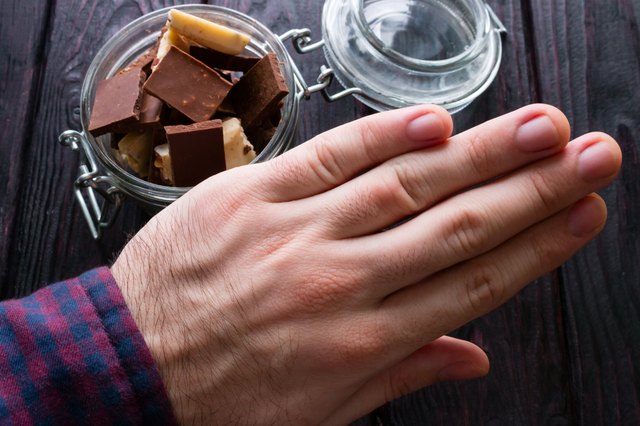 man refuses chocolate selective focus